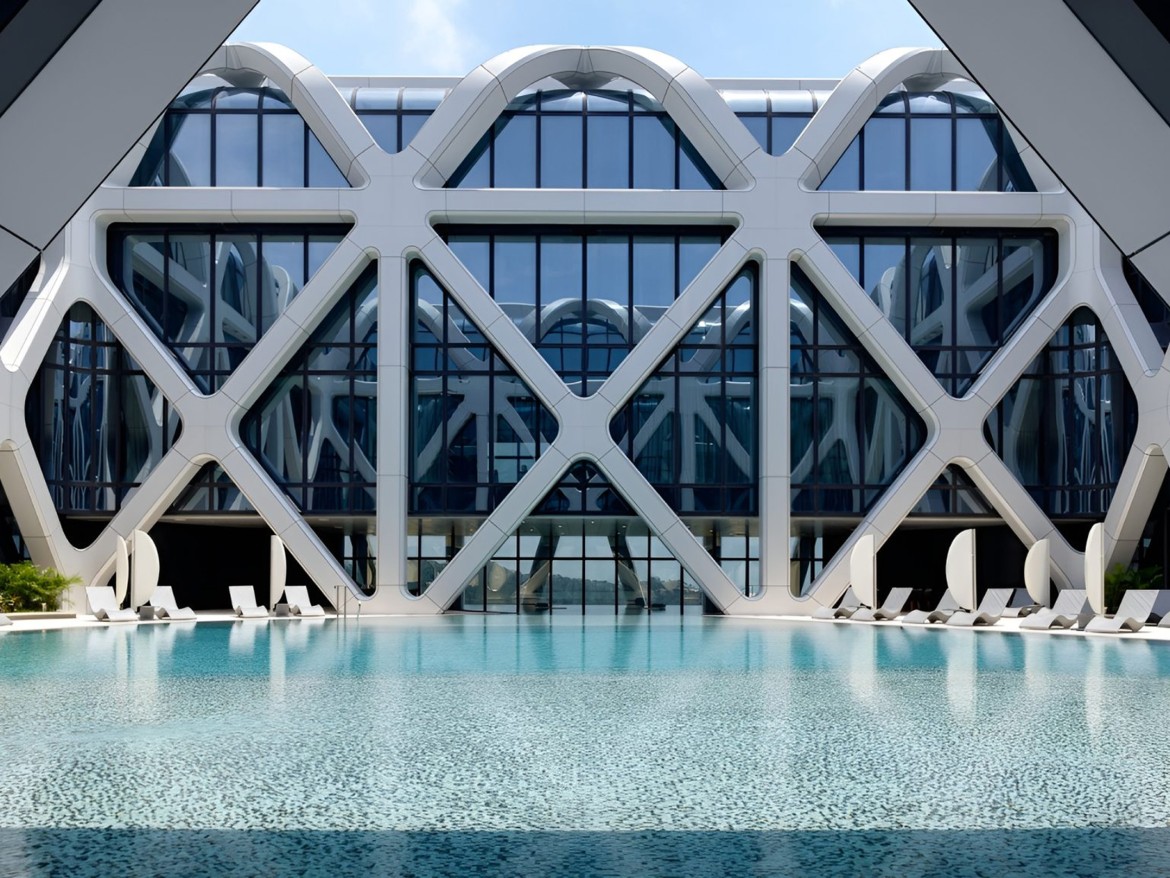 Morpheus Hotel, Macau – Poolside view with reflective water and geometric façade.