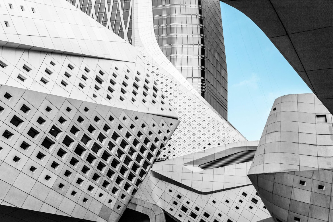 Nanjing International Youth Cultural Centre – Geometric façade with slanted walls and small square windows.