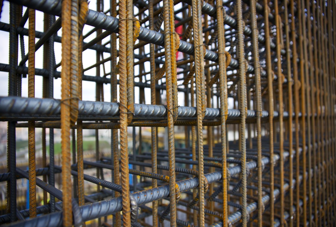 Close-up view of reinforced steel bars tied together for concrete construction.