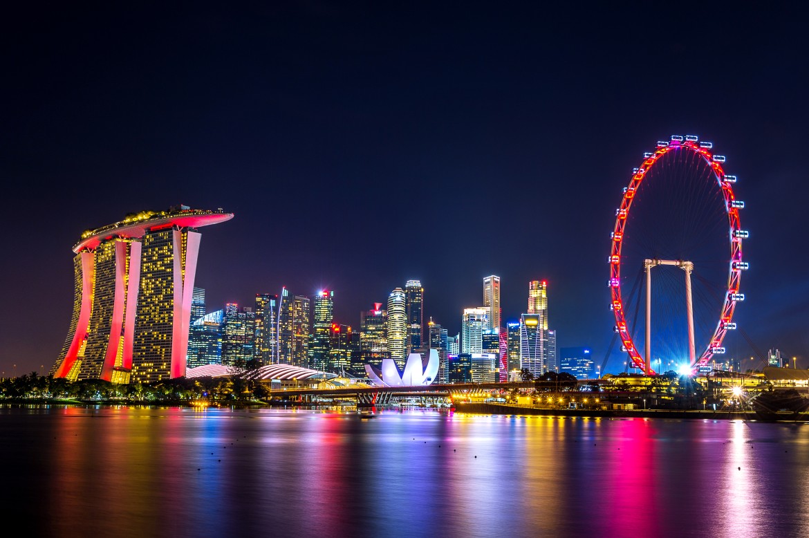 Singapore architectures at night featuring Marina Bay Sands, Singapore Flyer, and skyline reflections